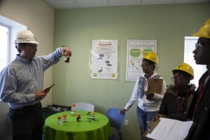 While still a student, Malik , and fellow students Arianna Idonia take part in a Green Jobs Corps program at GreenLeaf Biofuel plant in 2015.