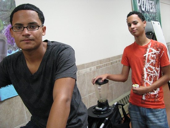 Common Ground students Joshua Cintron and Nelson Ruiz on a pedal-powered smoothie-maker.
