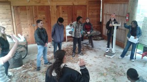 Dishaun helps teacher Rosana Anoh as they prepare for an immersion French class, speaking only French as they work on the farm.