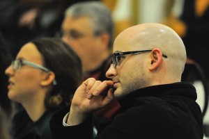 Common Ground English teacher Keith Lambert listens to testimony at the hearing. Photo by Mel Morales.