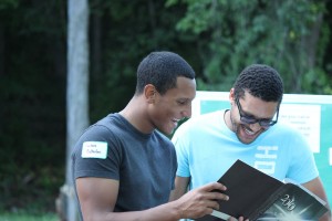 Alumni Carlos and a friend chat at the Senior Send Off in 2014.
