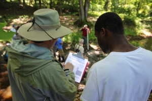 Science Teacher Dave Edgeworth and Tyreek, a member of the West River Stewards, join in a training on stream surveys. This past summer, the Stewards surveyed Wintergreen Brook from its headwaters to the confluence of with the West River.
