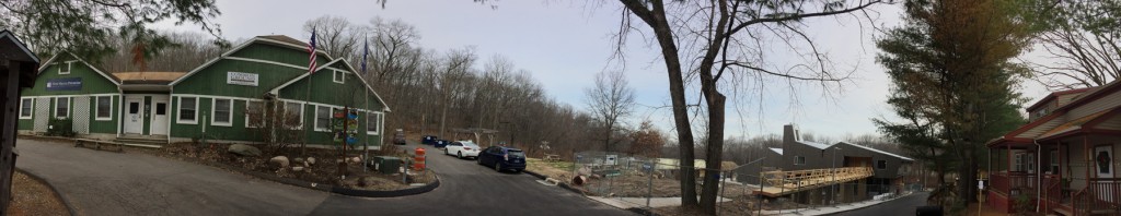 A panoramic photo showing the original Common Ground school, the new school building, and the farmhouse.