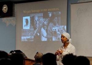 Leah Penniman -- farmer, social justice activist, educator -- speaks to all students at a POWER assembly. Photo Credit: Mel Morales.