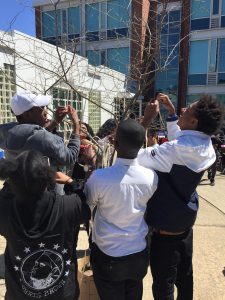 Students from New Haven high schools -- gathered for a city-wide Earth Day Youth Summit -- hang their hopes and commitments to action on ribbons. 