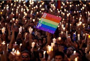 Supporters with candles at a vigil for the victims of Orlando Pulse shooting.