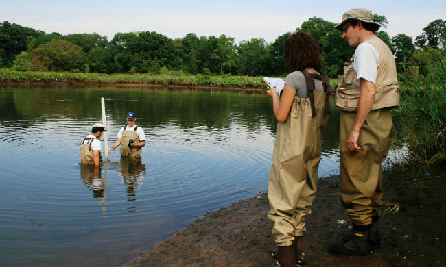 Common Ground High School students study water quality in the river that flows near their campus as a part of Green Jobs Corps, an environmental employment and leadership training program.