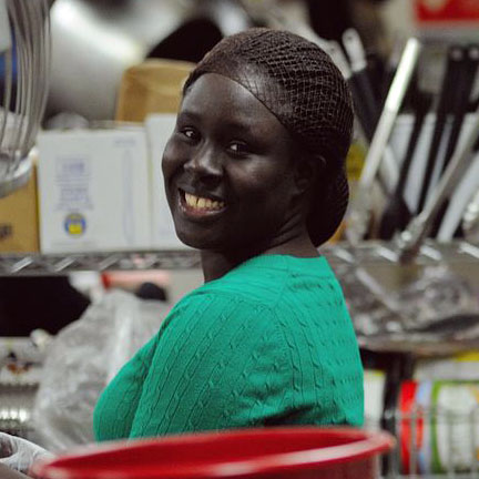 Fatou working in the kitchen