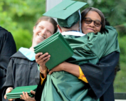 Teacher and staff celebrate graduate