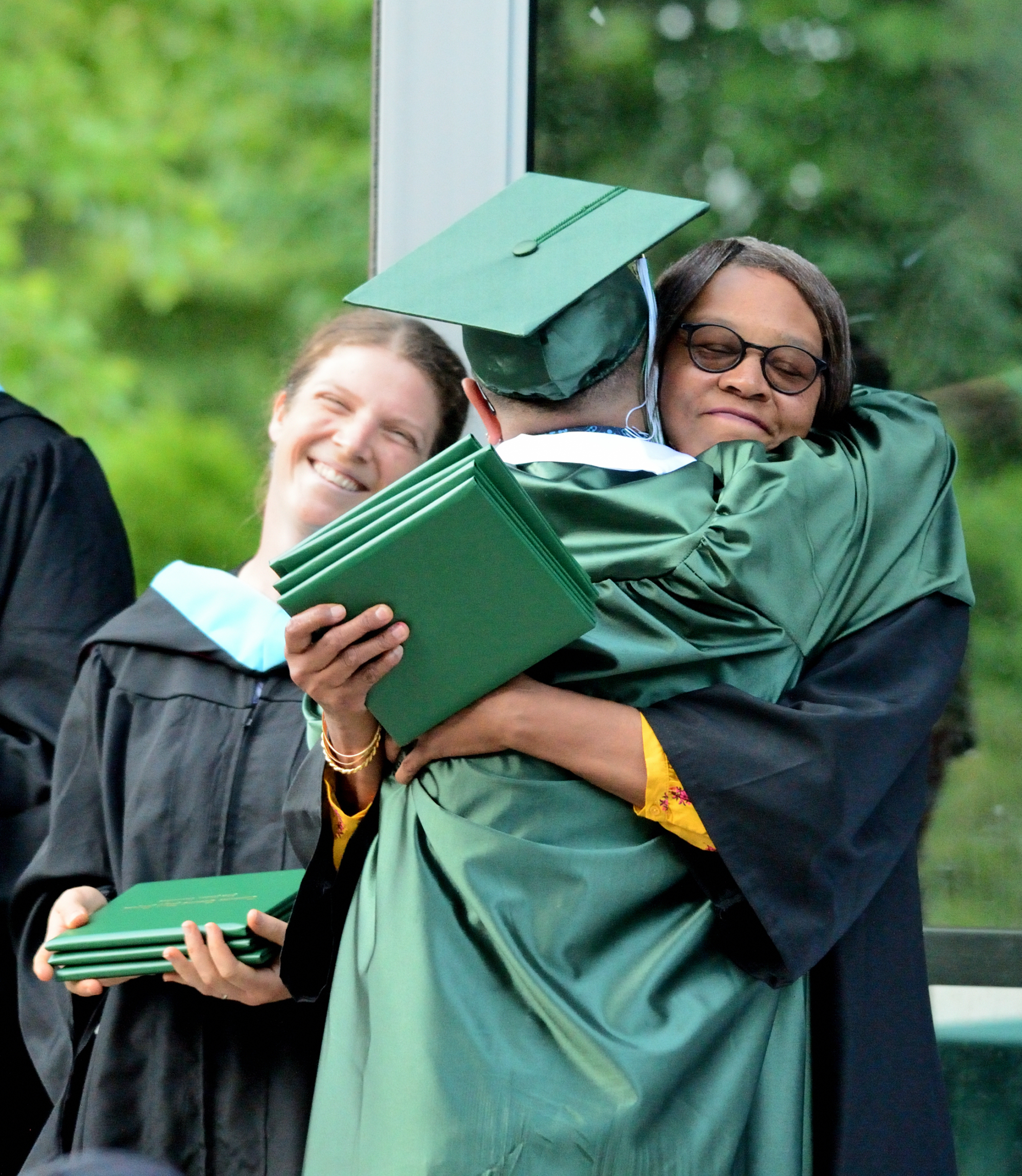 Teacher and staff celebrate graduate